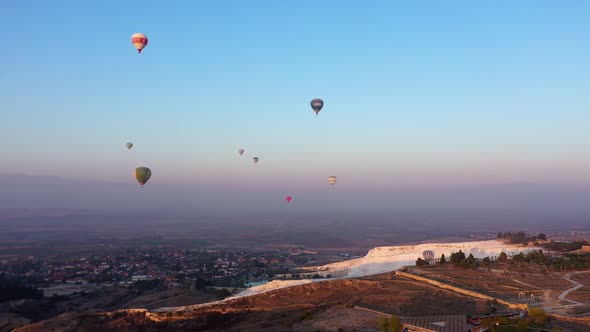 Landscape of Pamukkale Park and Hot Air Balloons in the Morning Sky alt