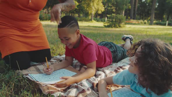 Closeup of Mixed Race Boy Peeping Into Classmate Exam Sheet Outdoors alt