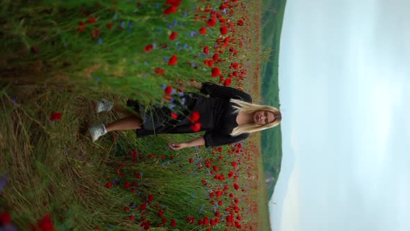 Young Blondie Girl in Poppy Field Walking Spring Time Walk on Camera