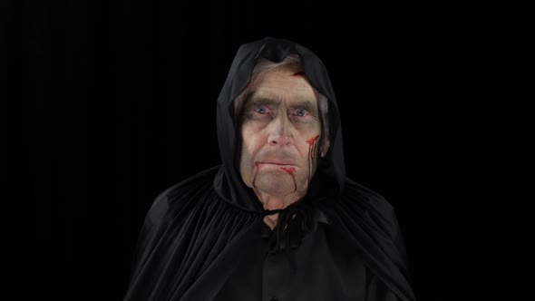 Old Executioner Halloween Makeup and Costume. Elderly Man with Blood on His Face alt