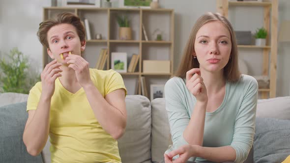 A Man with Fries Made From French Fries Makes His Girlfriend Laugh alt