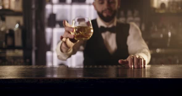 The Bartender Is Making a Presentation of Alcoholic Drink for the Client alt