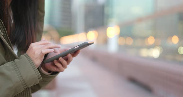 Woman using smart phone at outdoor alt