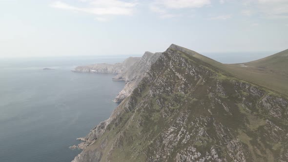 Green Rocky Mountains And Cliffs Of Achill Island In Ireland - aerial shot alt