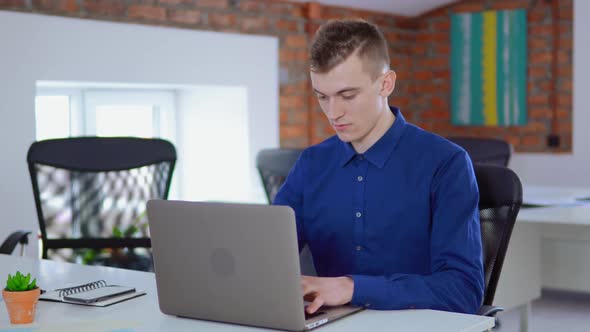 Caucasian Employee Male at Workplace alt