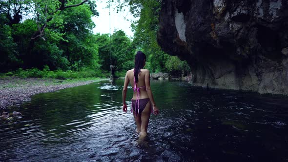 Cute Asian Girl Walking in Bikini in the River Thailand