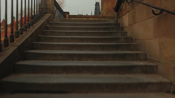 Climbing the Stairs Towards Charles Bridge in Prague, Czech Republic (Czechia) alt