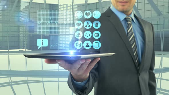 Man showing digitally generated medical icons on tablet alt