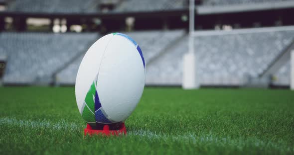 Rugby ball on a grass in the stadium alt