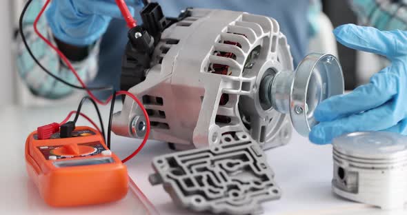 Mechanical Engineer Diagnosing Breakdown of Car Alternator Using Tester Closeup  Movie alt