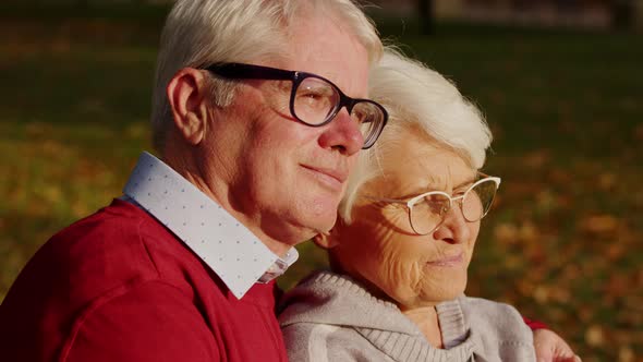 Elderly Caucasian Married Couple Looking Back Woman Looks at Her Husband Portrait Selective Focus alt