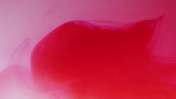 Red ink dissolving in water alt