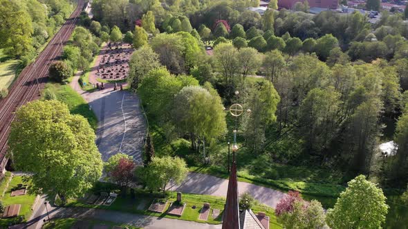 Church Tower Cross and Forest and Village Background Aerial Circling