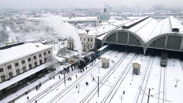 Aerial View of Old Retro Train Steam Locomotive at Lviv Railway Station alt