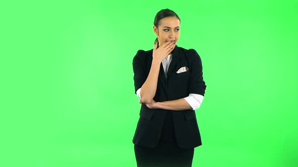 Girl Listens Carefully To Boring Information and Looks Around. Green Screen alt
