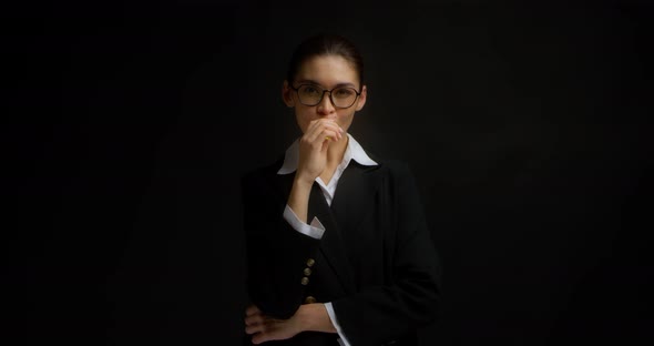Business Woman Vaping on an Isolated Black Background