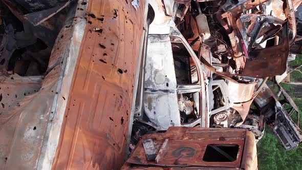 Vertical Video of Burnt and Shot Cars During the War in Ukraine alt