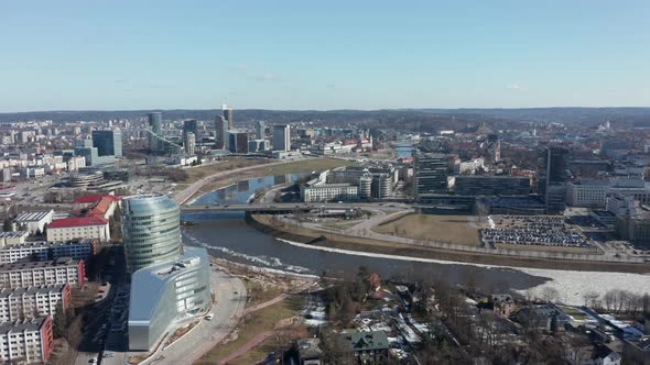 AERIAL: Rotating Shot of Vilnius Panorama with River Neris and Buildings in the Background