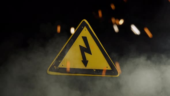 High Voltage Sign Over a Smoky Background