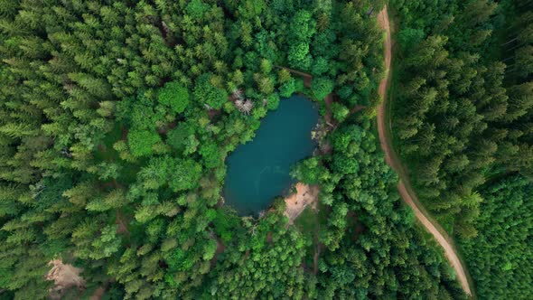Aerial View of Blue Colored Forest Lake in Poland alt