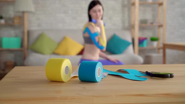 Close Up Colorful on the Table Rolls Kinesiotape Background Sports Female Athlete with a Tape on His alt