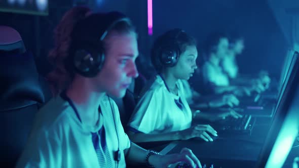 Focused Team Gamers Plays a Video Game Cyber Sportsmans at the International Competition Tense alt