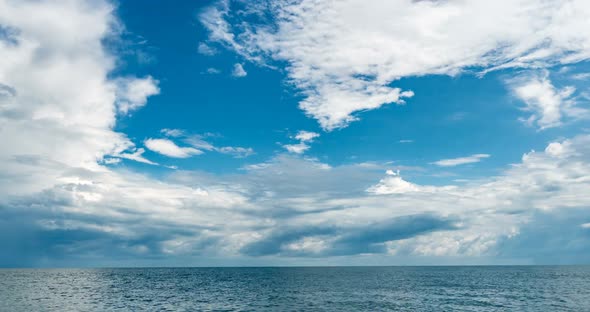 Time Lapse of the Sea and Blue Sky White Clouds Evolve and Change Shape Dynamic Weather Beautiful alt