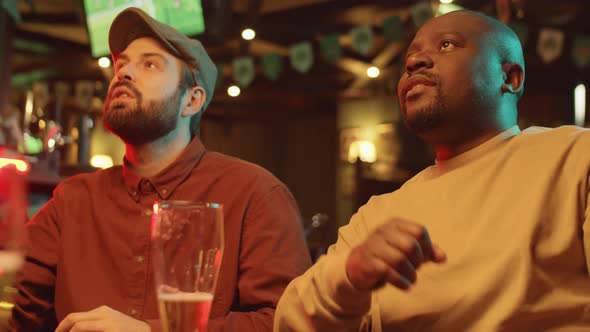 Watching Football Match In Pub alt