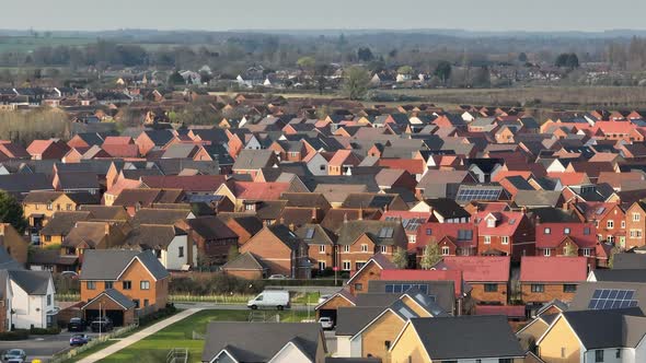 Modern Houses and Homes on a UK New Build Estate Seen From The Air alt