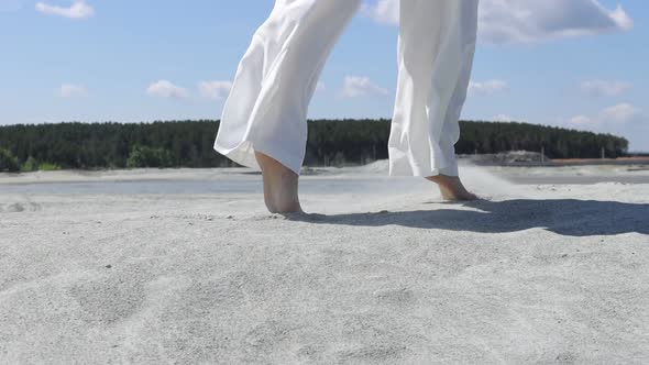 Beautiful Woman Walking on Shore