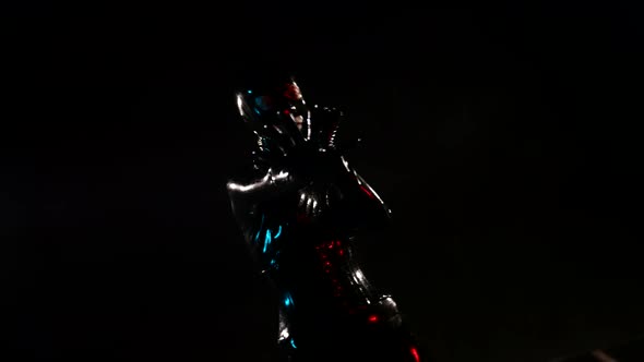 Fantasy Shot of Alien or Person in Latex Suit in Darkness Moving Silhouette alt