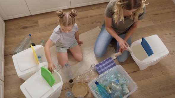 Video of family separating recycling material at home. Shot with RED helium camera in 8K alt