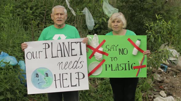 Senior Volunteers with Protesting Posters Our Planet Needs Help, Say No To Plastic. Nature Pollution alt