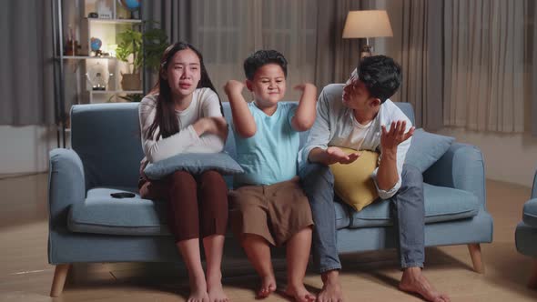 Upset Asian Family Is Frustrated About The Loss Of The Team In Game They Are Watching Tv At Home alt
