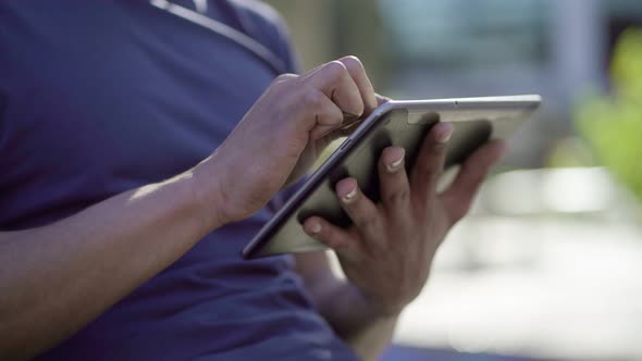 Closeup of Afro-American Male Hands Holding Tablet, Typing alt