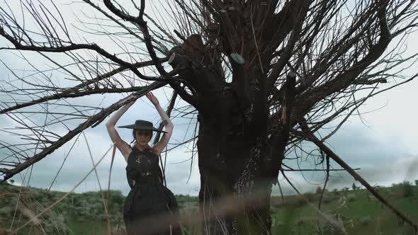 Portrait Of Pretty Blonde In Black Hat. Face With Professional Makeup. alt