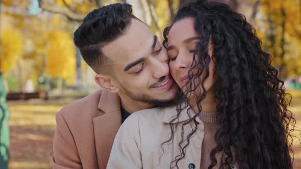 Closeup Hispanic Couple Guy Embracing Girl Romantic Date in Autumn Park Lovers Enjoy Tenderness alt