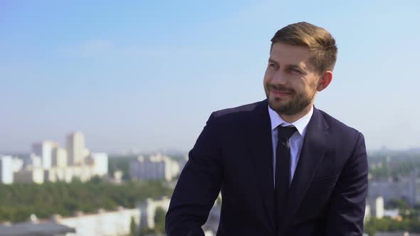 Smiling Male Office Worker Enjoying Cityscape Sitting Terrace, Rest Outdoors