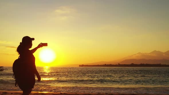Girl enjoys life on marine sea view beach lifestyle by blue green lagoon with white sand background  alt