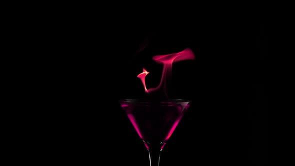 Fire blowing out of martini glass, Slow Motion alt