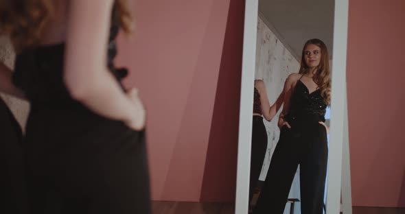 Two Beautiful Women Having Fun When Getting Ready at the Mirror Indoor alt