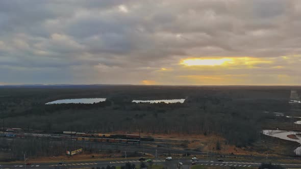 Aerial View of Residential Houses and Driveways Neighborhood During a Fall Sunset Housing Community alt