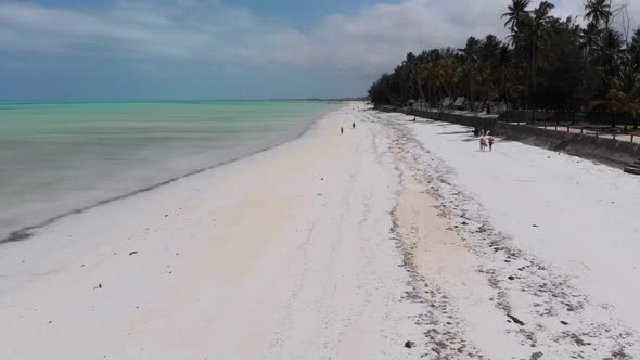 Ocean Coastline with Paradise Beach Hotels and Palm Trees Zanzibar Aerial View alt