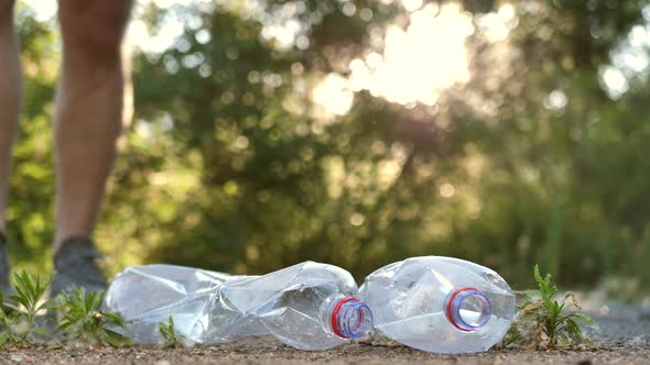 Closeup Volunteer Activist in Gloves Cleans Up Garbage in the Park Saves the Environment From alt