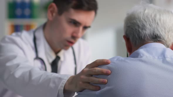 Close Up of Doctor Comfort Aged Patient with Incurable Disease Diagnosis alt