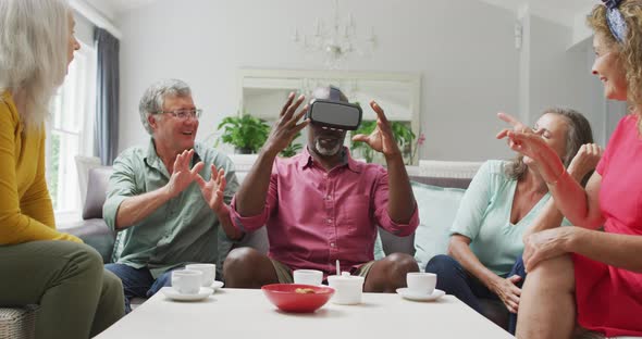 Animation of diverse female and male senior friends using vr headset and having fun alt