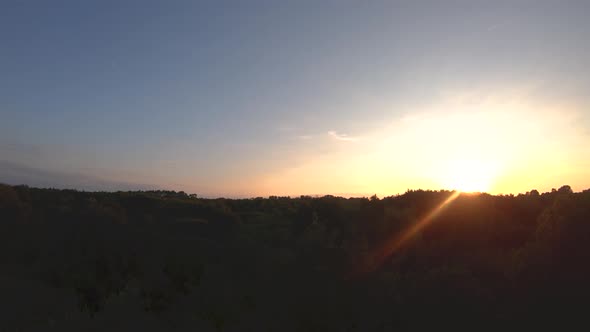 Langeoog, Germany: The city and above the forest at the sunset drone bird's eye view alt
