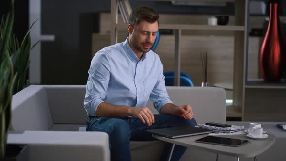 Businessman Finishing Conference Call Leaving Office Work in Remote Workplace alt