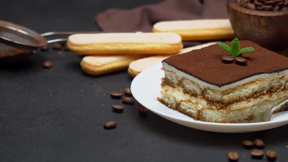 Portion of Traditional Italian Tiramisu Dessert and Coffee Beans alt