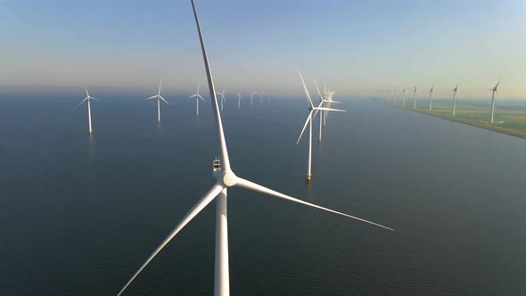 Wind Turbines in the Early Morning Wind Mill Park in the Netherlands alt